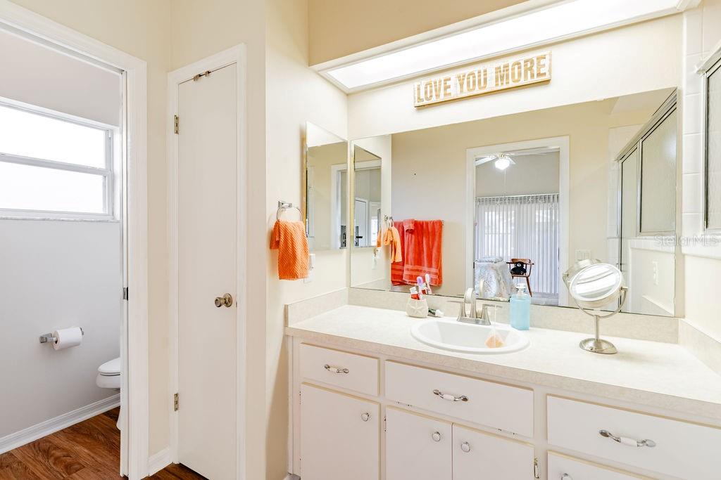 6555 Wilander Street Leesburg, FL 34748 - Photo 22 of 45 a bathroom with a sink and a mirror