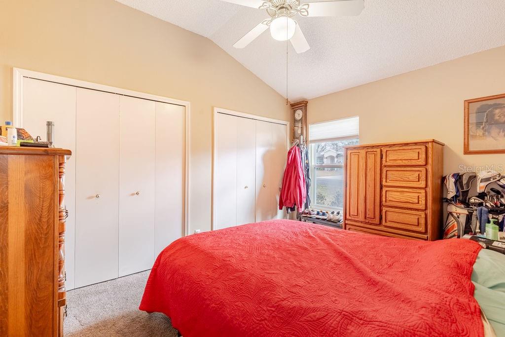 6555 Wilander Street Leesburg, FL 34748 - Photo 23 of 45 a bed room with a bed and a walk in closet