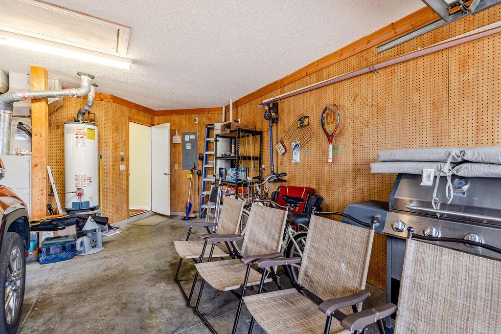 6555 Wilander Street Leesburg, FL 34748 - Photo 27 of 45 a living room with furniture and a floor to ceiling window