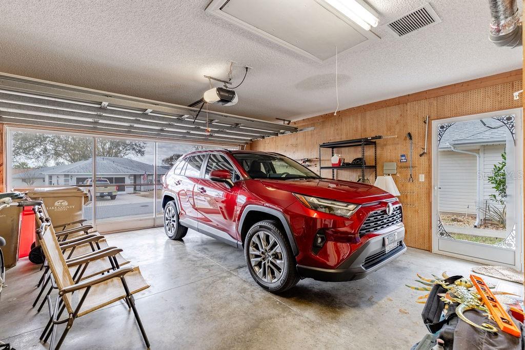 6555 Wilander Street Leesburg, FL 34748 - Photo 28 of 45 a car is parked in a garage
