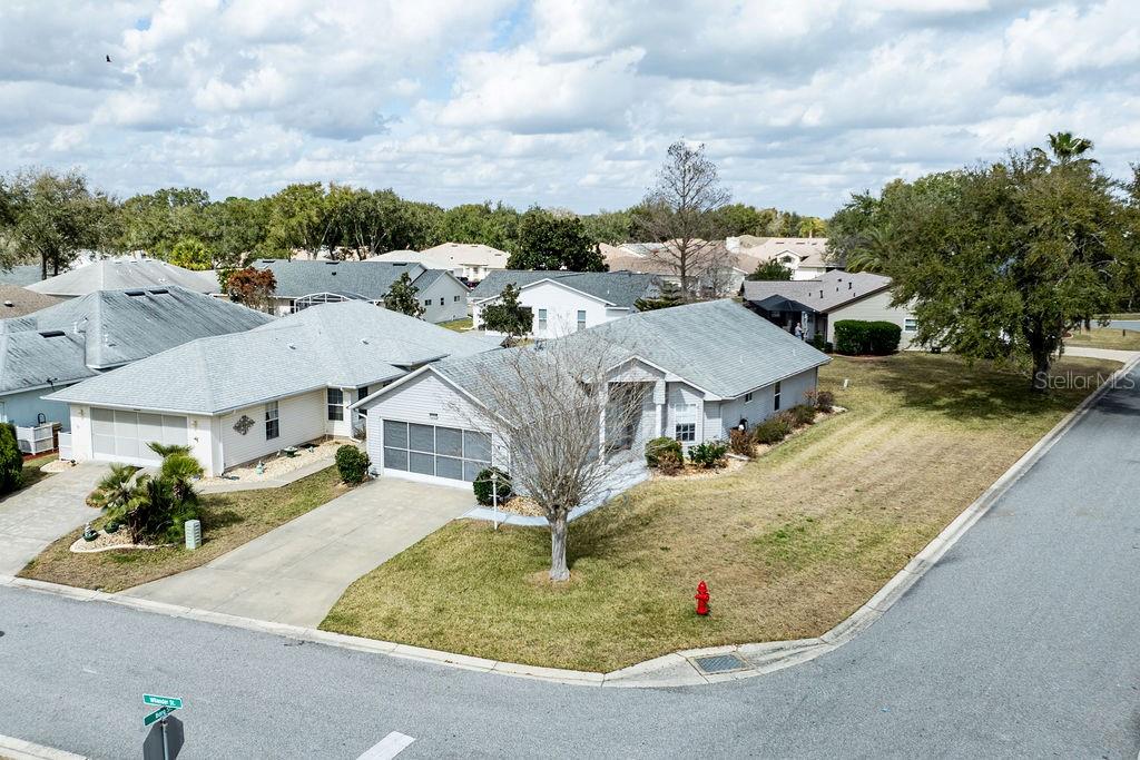 6555 Wilander Street Leesburg, FL 34748 - Photo 30 of 45 an aerial view of residential houses with outdoor space