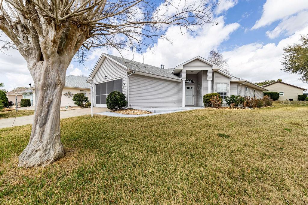 6555 Wilander Street Leesburg, FL 34748 - Photo 3 of 45 a view of a house with a yard