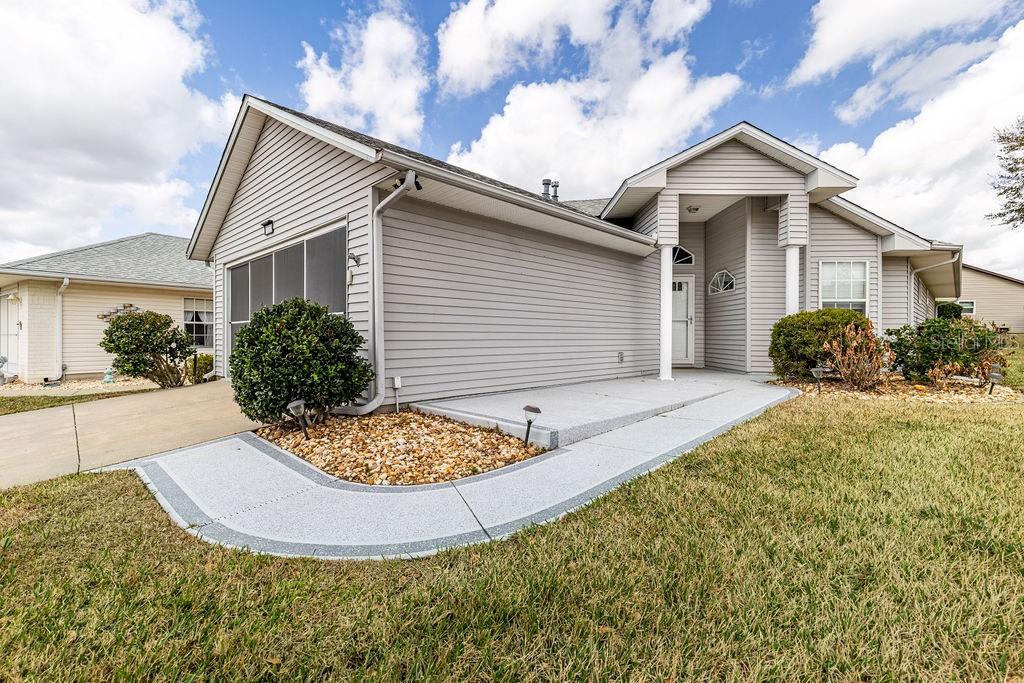6555 Wilander Street Leesburg, FL 34748 - Photo 5 of 45 a view of a white house next to a yard