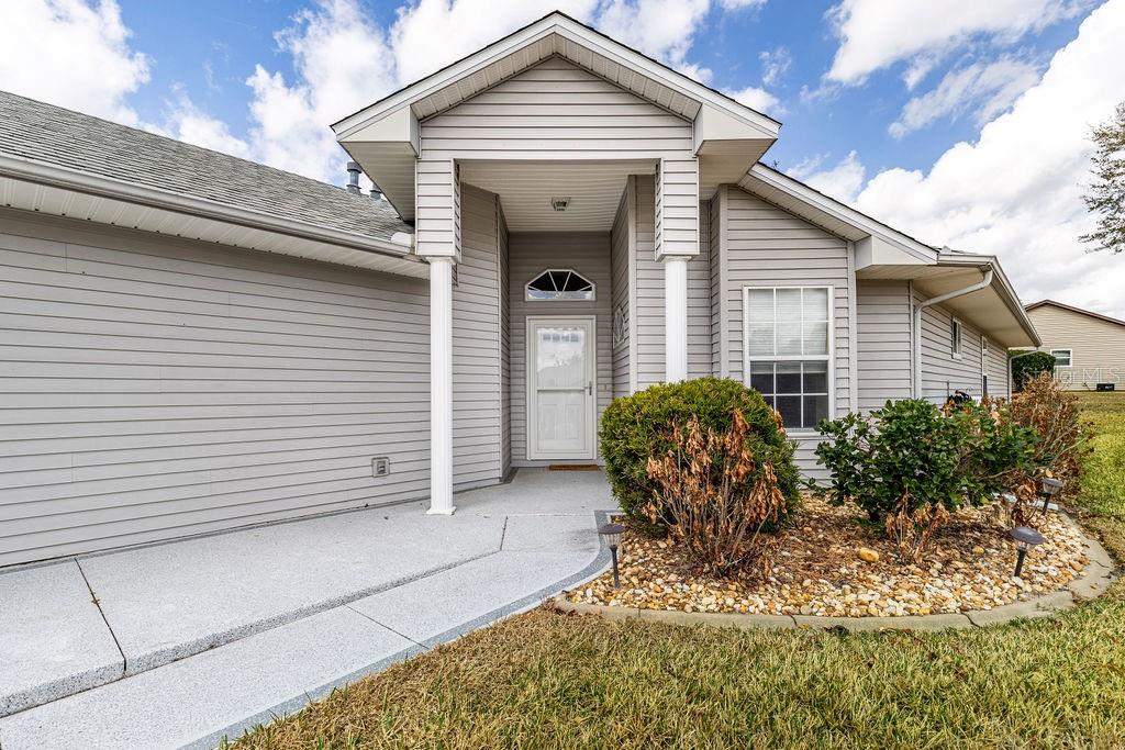 6555 Wilander Street Leesburg, FL 34748 - Photo 6 of 45 a front view of a house with garden