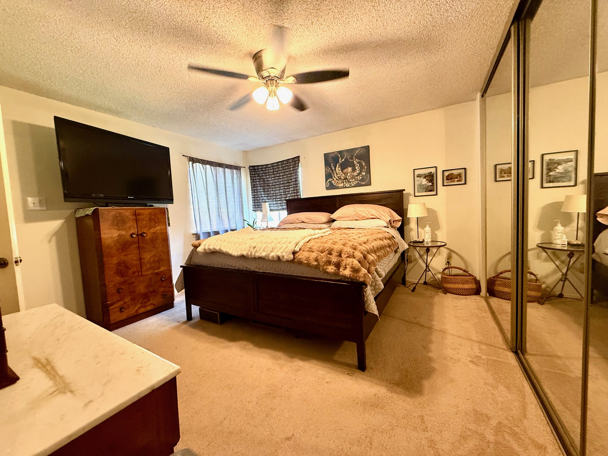 16704 Whitebrush Loop Austin, TX 78717 - Photo 11 of 20 a bedroom with a bed and a flat screen tv