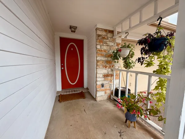a view of front door with wooden floor