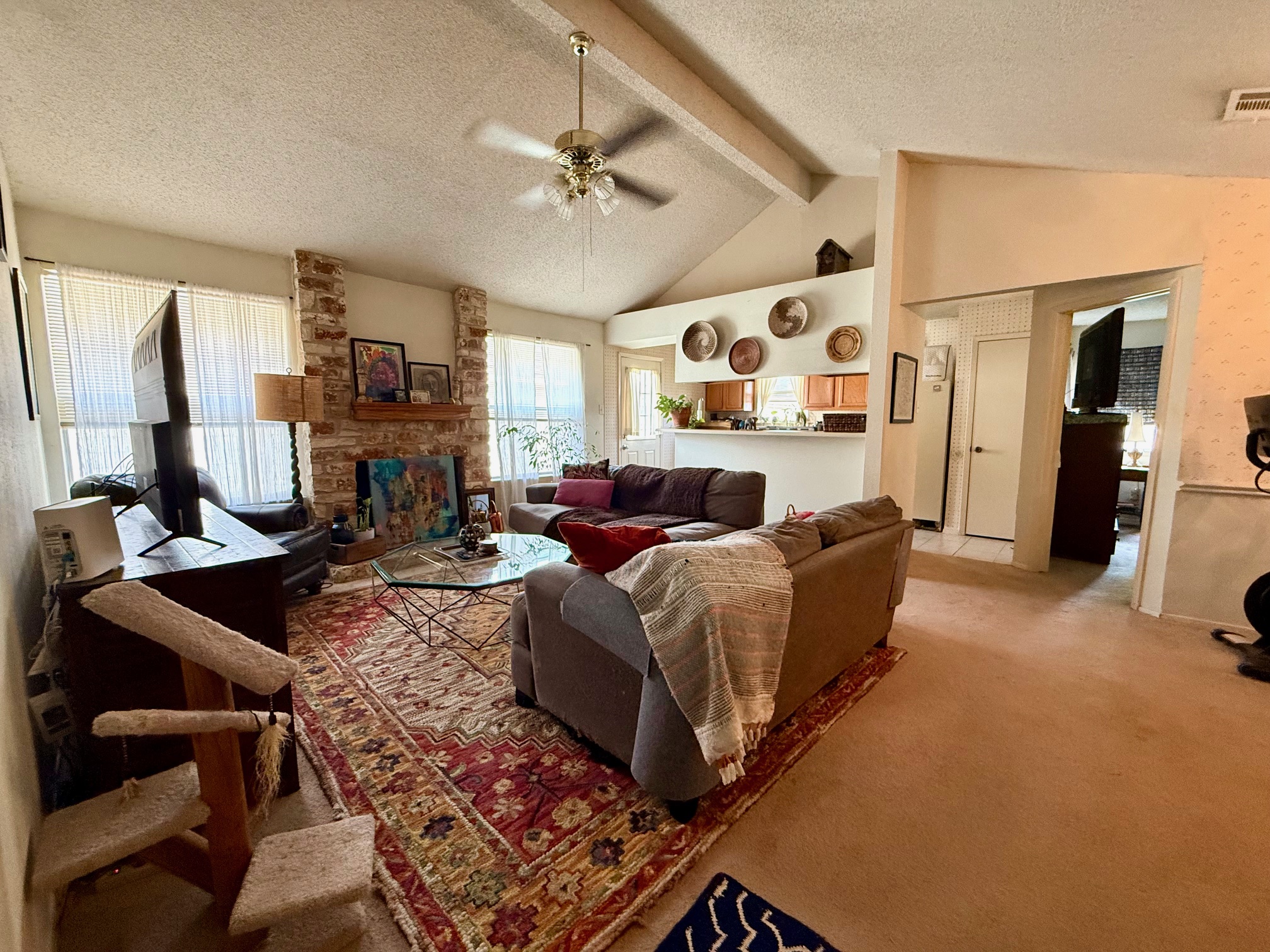 16704 Whitebrush Loop Austin, TX 78717 - Photo 4 of 20 a living room with furniture and a chandelier