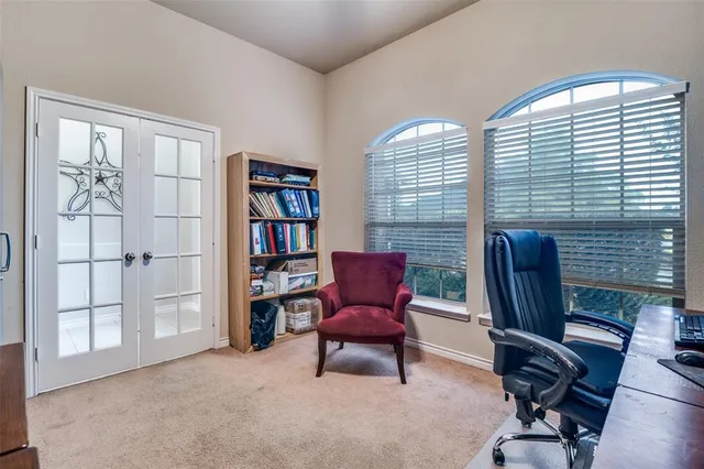 a view of a livingroom with furniture and a window