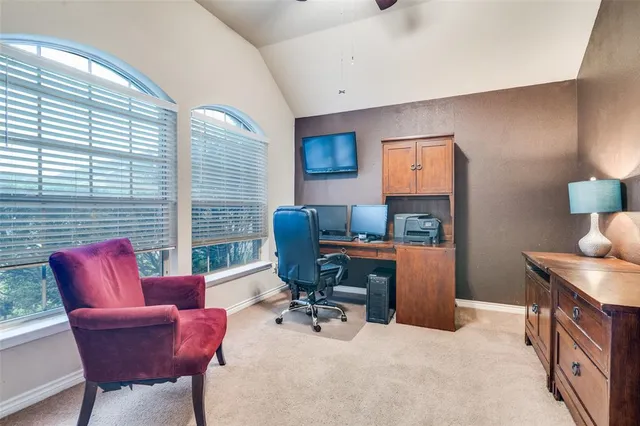 a workspace with furniture and window