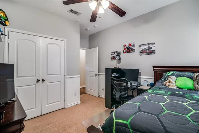 a bedroom with furniture and a wooden floor