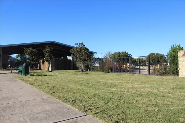 a view of swimming pool with outdoor seating and lake view