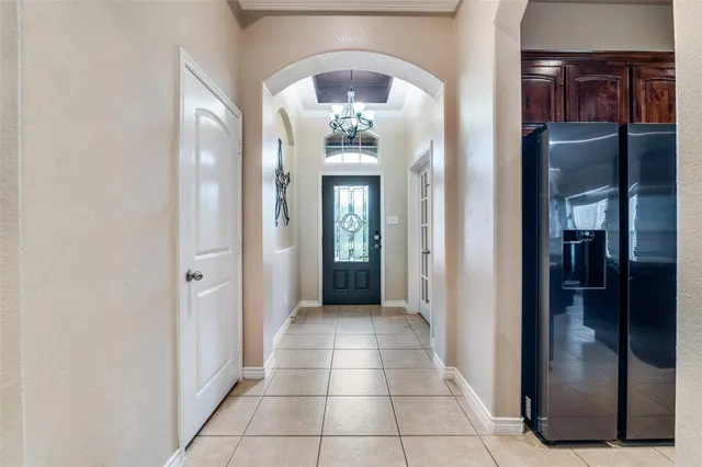 a view of a hallway with wooden shelves