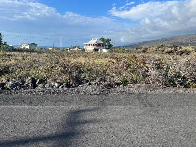 a view of a road with an ocean view