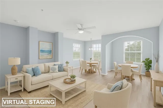 a living room with furniture and a large window