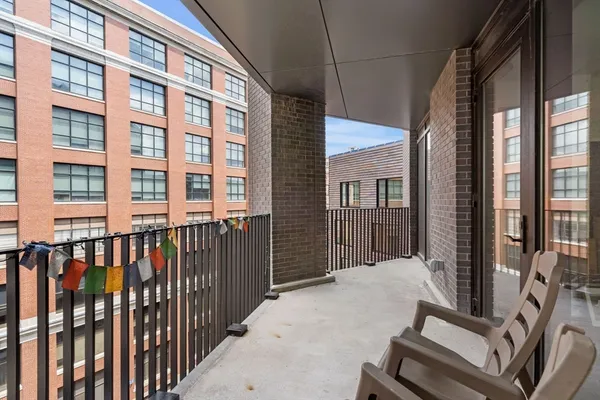 a view of a balcony with wooden floor
