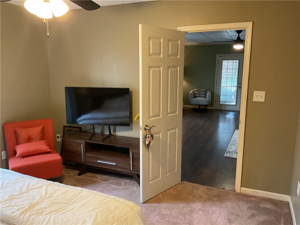 229 Cub Cove Drive Walhalla, SC 29691 - Photo 47 of 50 This cozy bedroom offers a tranquil retreat with plush carpeting and convenient access to adjacent living spaces.