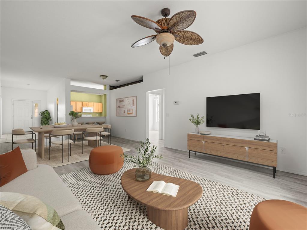 30638 Nickerson Loop Wesley Chapel, FL 33543 - Photo 19 of 39 a living room with furniture a rug and a flat screen tv