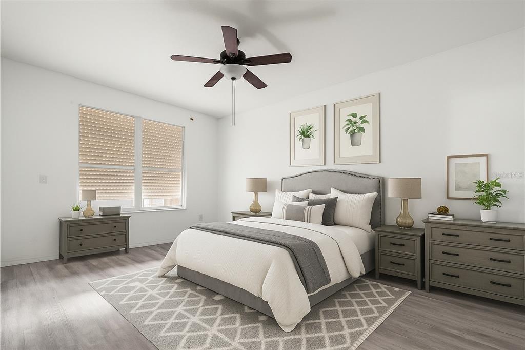 30638 Nickerson Loop Wesley Chapel, FL 33543 - Photo 23 of 39 a bedroom with a large bed and a window