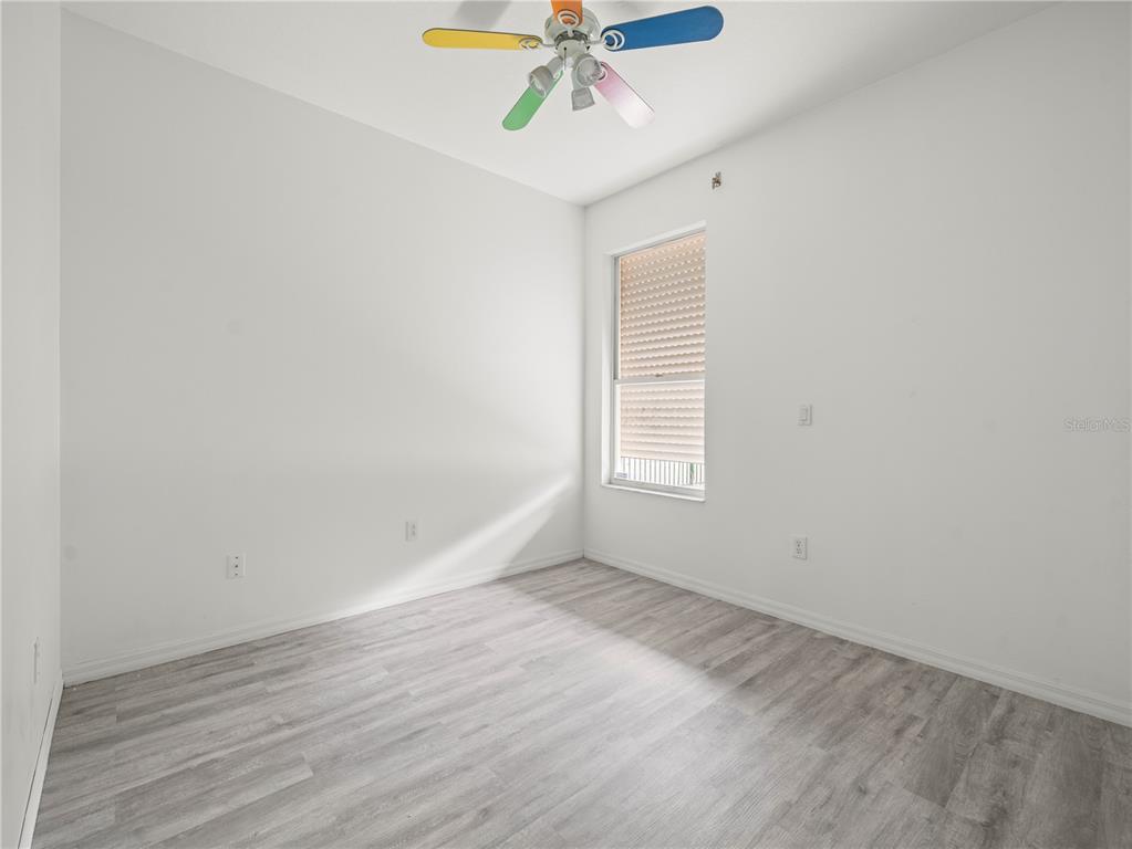 30638 Nickerson Loop Wesley Chapel, FL 33543 - Photo 28 of 39 wooden floor in an empty room with a window