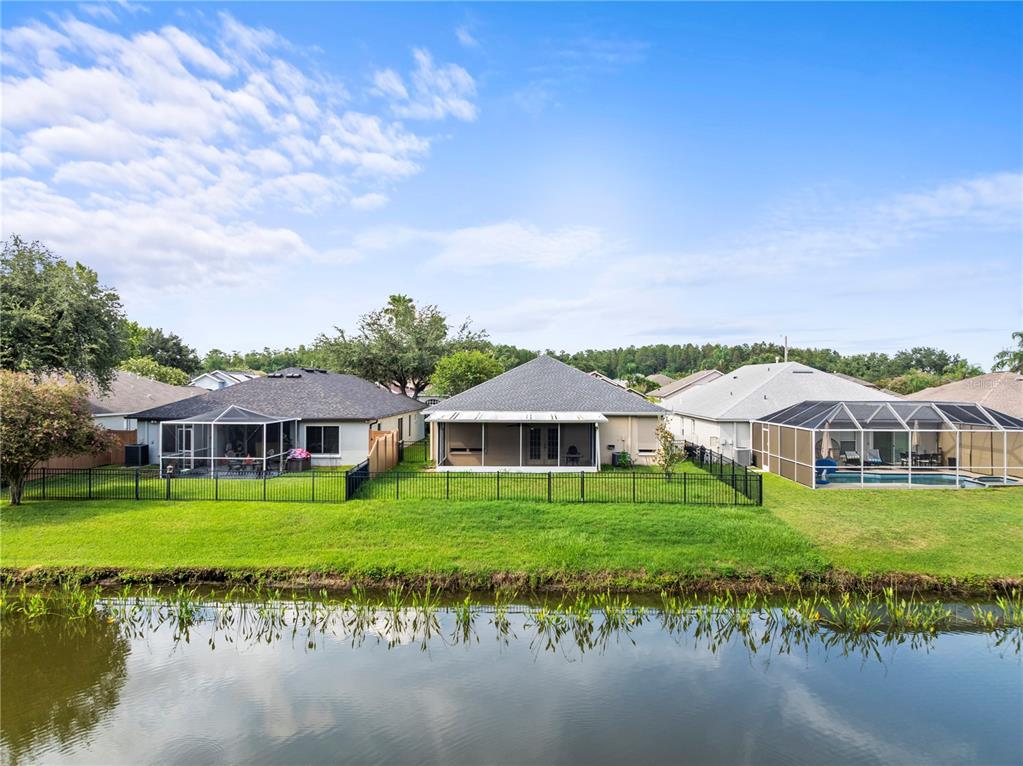 30638 Nickerson Loop Wesley Chapel, FL 33543 - Photo 34 of 39 a front view of a house with garden