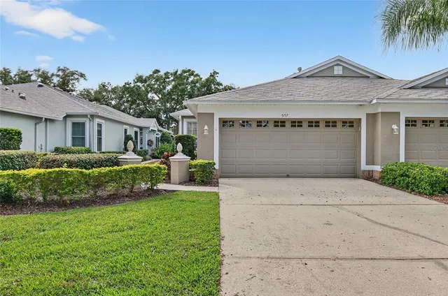 front view of a house with a garden