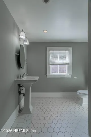 a view of a room that has a bench in it