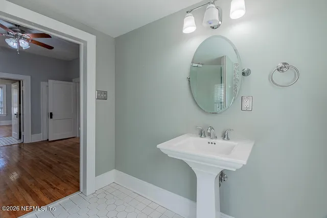 a bathroom with a sink and a mirror