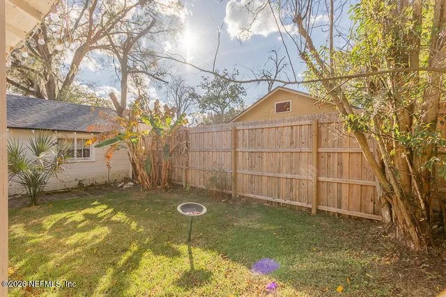 a view of a back yard of the house