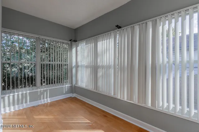 a view of a room with a large window