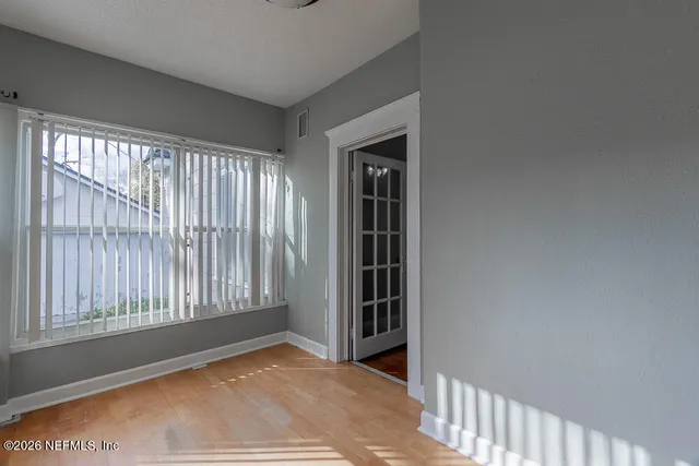 a view of an empty room with a window