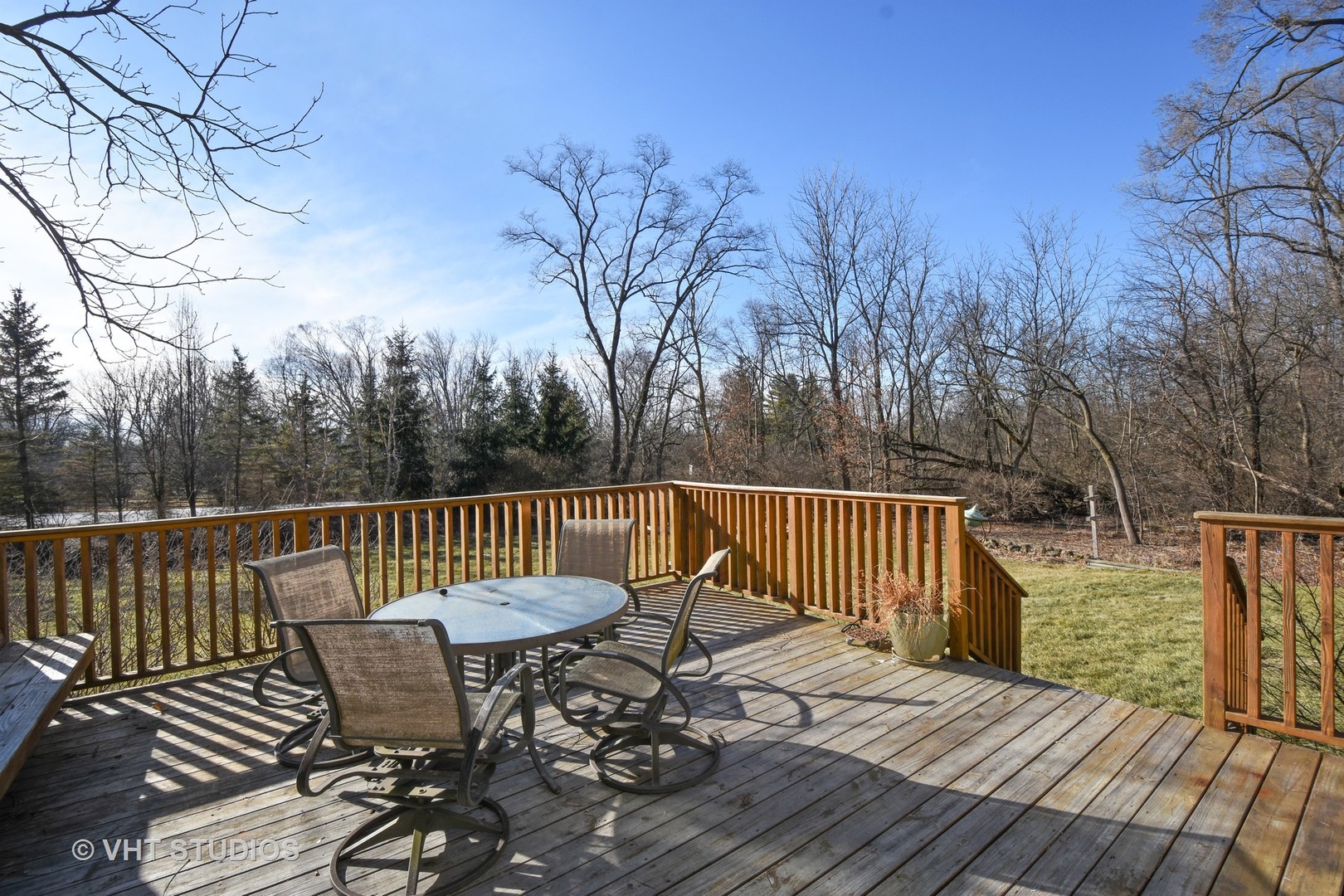 176 Old Sutton Road Barrington Hills, IL 60010 - Photo 22 of 27 a view of a chairs on wooden deck