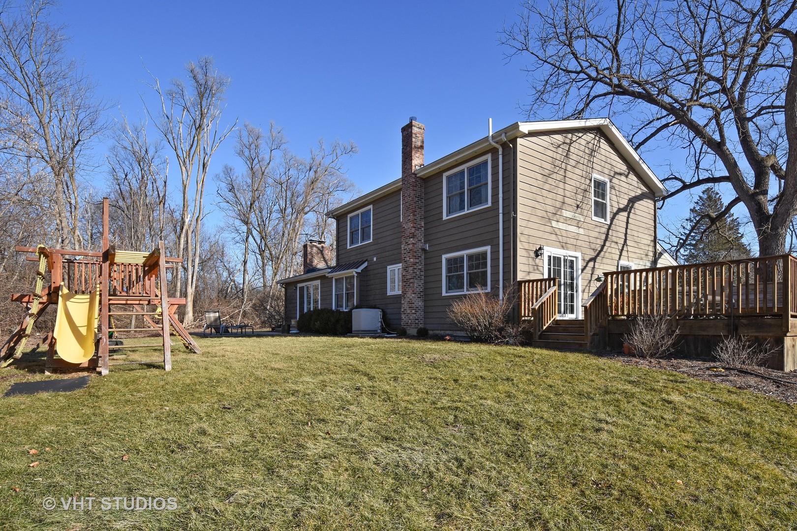 176 Old Sutton Road Barrington Hills, IL 60010 - Photo 24 of 27 a view of a house with a yard and a tree