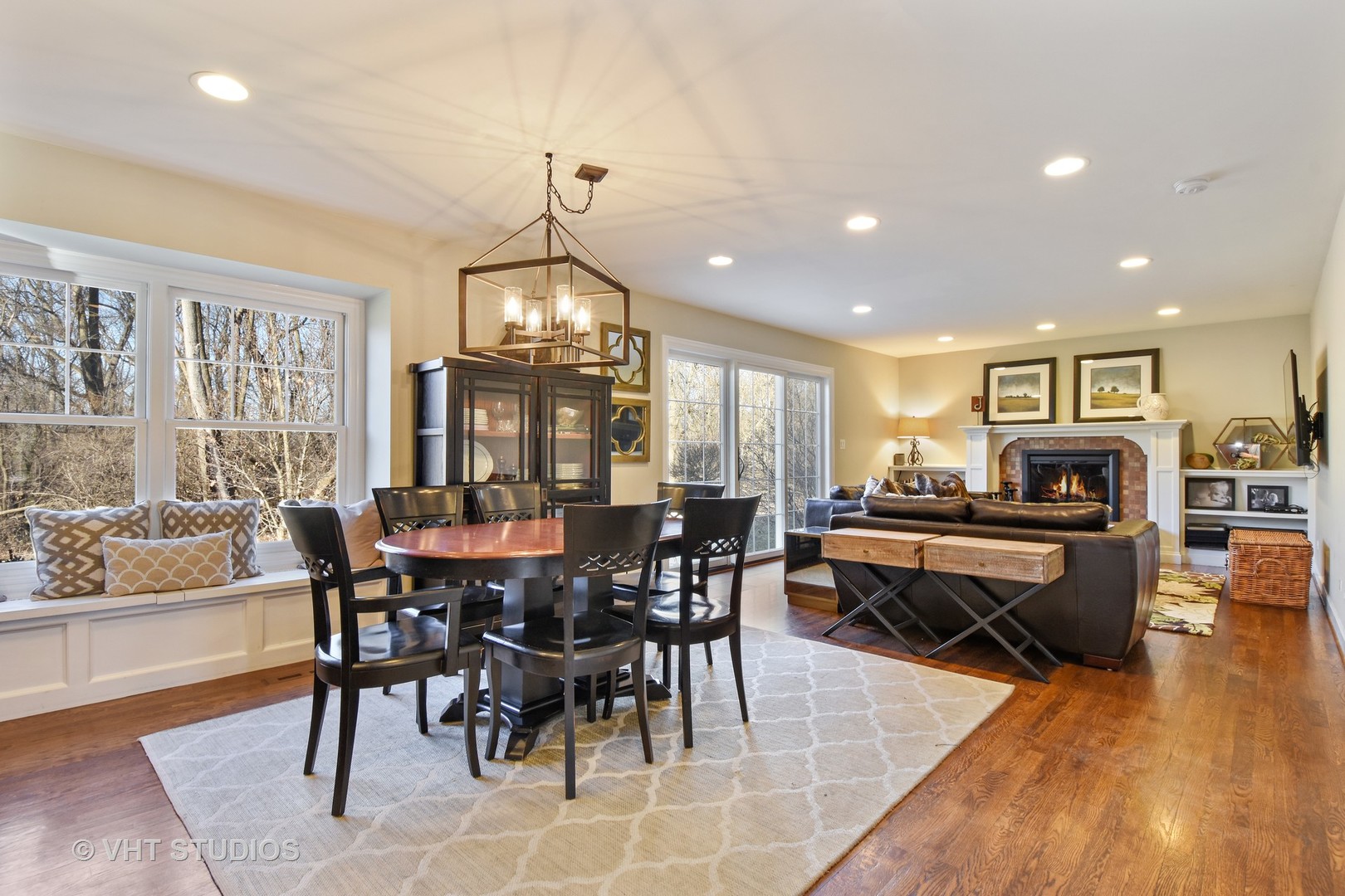 176 Old Sutton Road Barrington Hills, IL 60010 - Photo 5 of 27 a view of a dining room with furniture window and wooden floor
