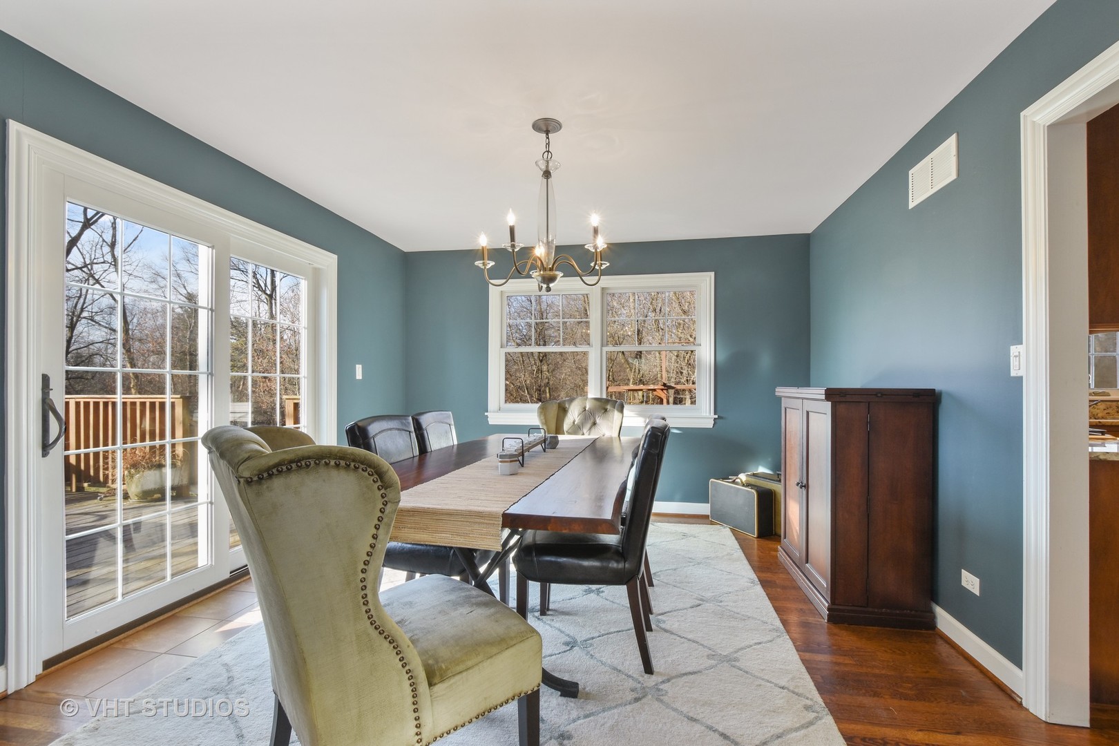 176 Old Sutton Road Barrington Hills, IL 60010 - Photo 8 of 27 a dining room with furniture window and wooden floor