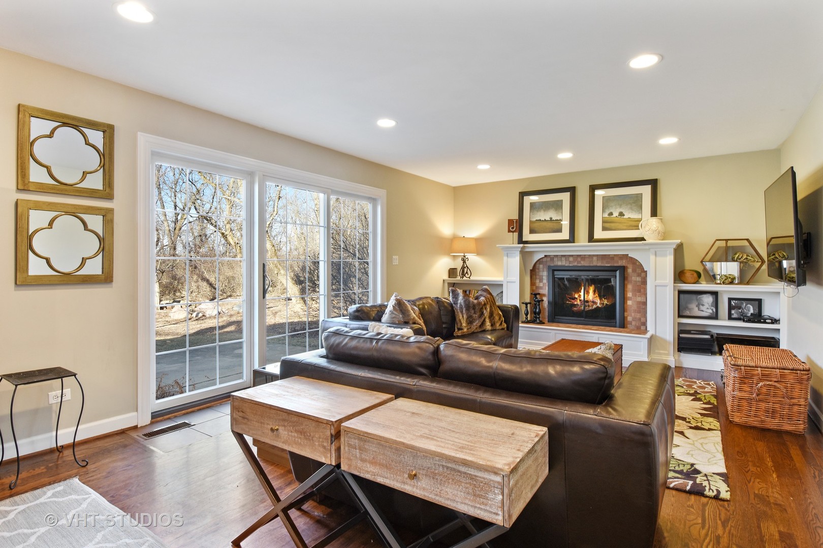 176 Old Sutton Road Barrington Hills, IL 60010 - Photo 9 of 27 a living room with fireplace furniture and a large window