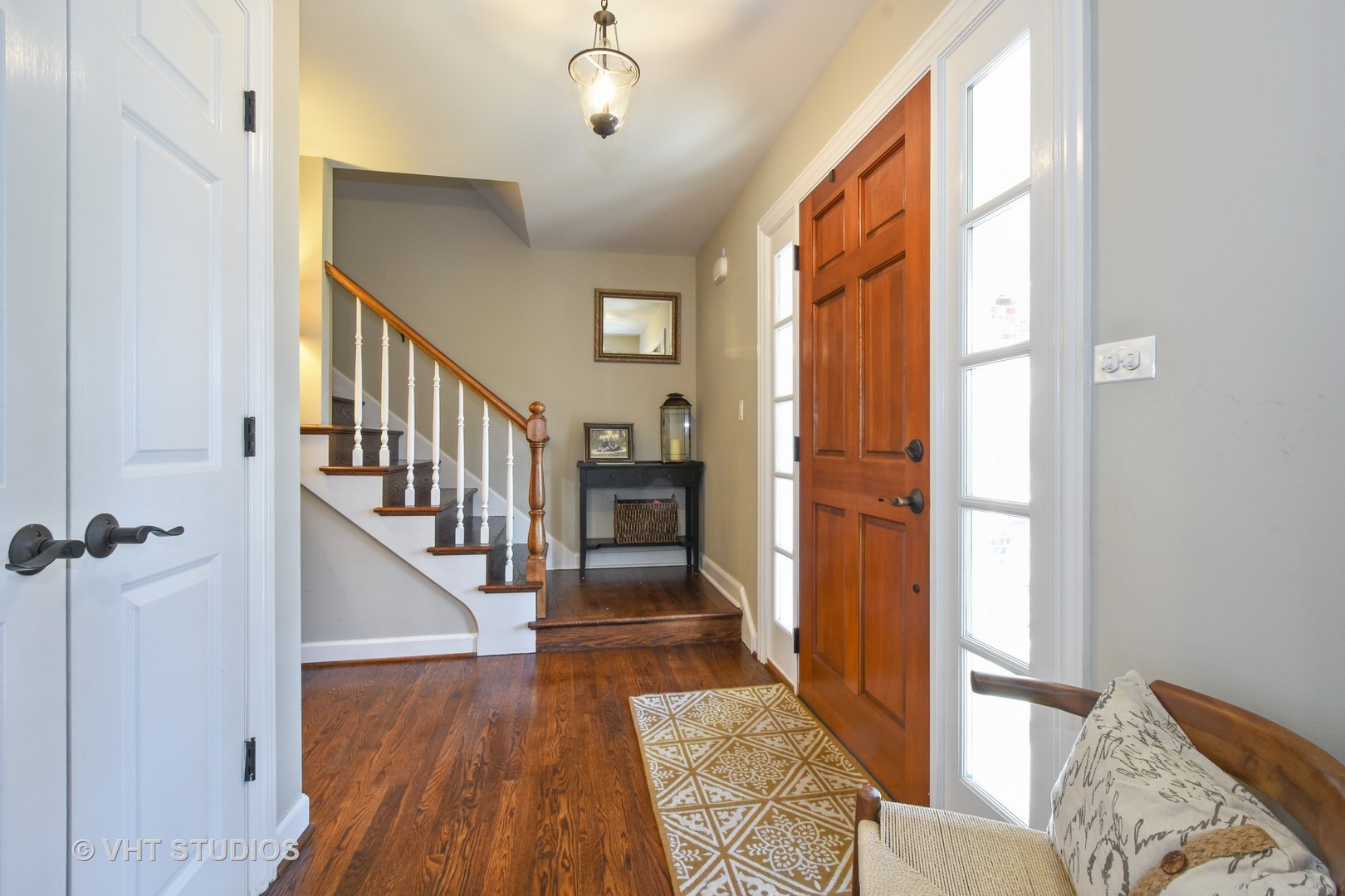 176 Old Sutton Road Barrington Hills, IL 60010 - Photo 10 of 27 a view of a hallway with wooden floor and staircase