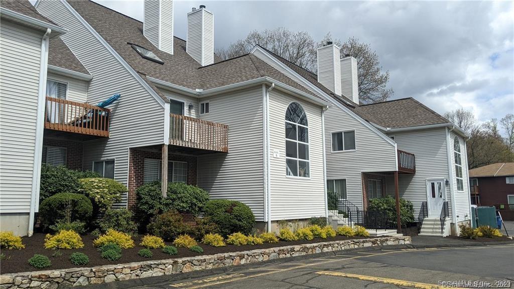 3200 Madison Avenue, Unit D10 Bridgeport, CT 06606 - Photo 1 of 12 a front view of a house with a yard