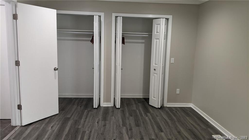 3200 Madison Avenue, Unit D10 Bridgeport, CT 06606 - Photo 10 of 12 a view of a hallway with wooden floor