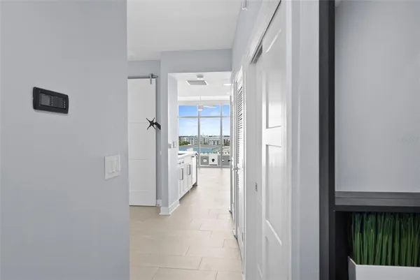 a view of a hallway with white walls