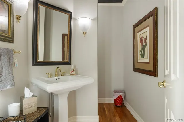 a kitchen with stainless steel appliances granite countertop a sink and a refrigerator