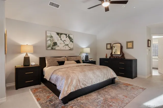 a bedroom with a bed and a chair