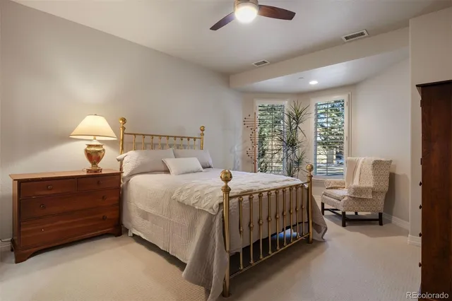 a bedroom with bed and window