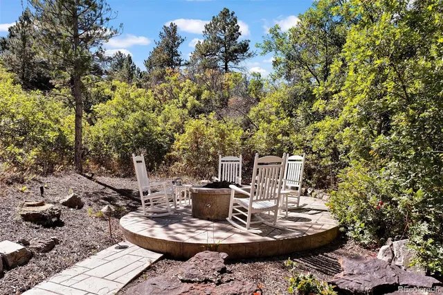 a patio with tables and chairs