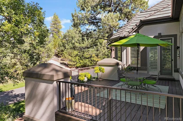 a view of a chairs and table in the balcony