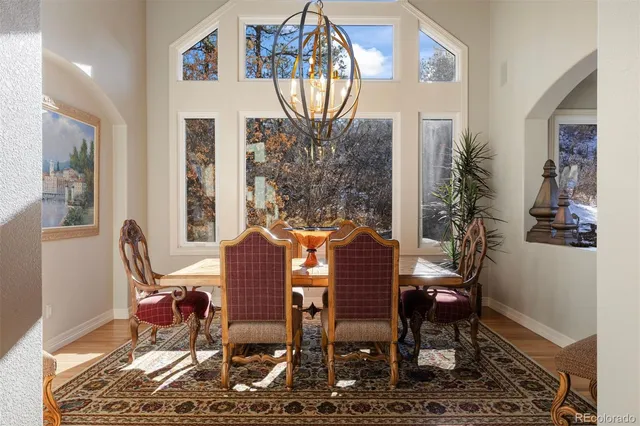 a view of a dining room with furniture window and wooden floor
