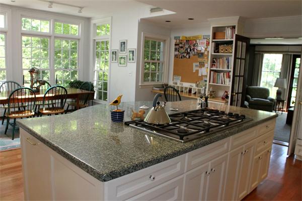 6 Wampatuck Road Dedham, MA 02026 - Photo 14 of 30 a kitchen with stainless steel appliances granite countertop a sink stove and refrigerator