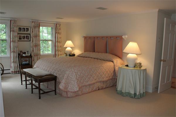 6 Wampatuck Road Dedham, MA 02026 - Photo 16 of 30 a bedroom with a bed and a chandelier