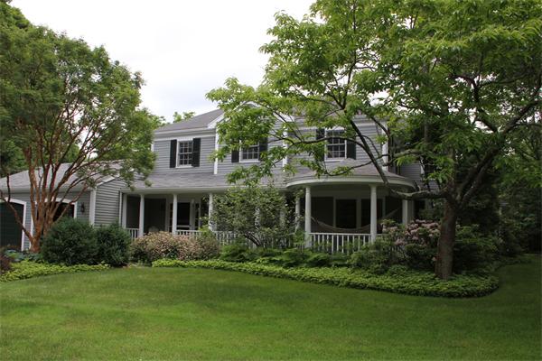 6 Wampatuck Road Dedham, MA 02026 - Photo 2 of 30 a front view of a house with a garden