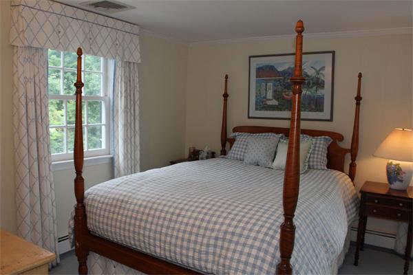 6 Wampatuck Road Dedham, MA 02026 - Photo 22 of 30 a bedroom with a bed a window and potted plant