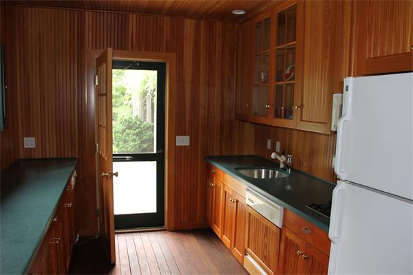 6 Wampatuck Road Dedham, MA 02026 - Photo 30 of 30 a kitchen with granite countertop a refrigerator and a stove